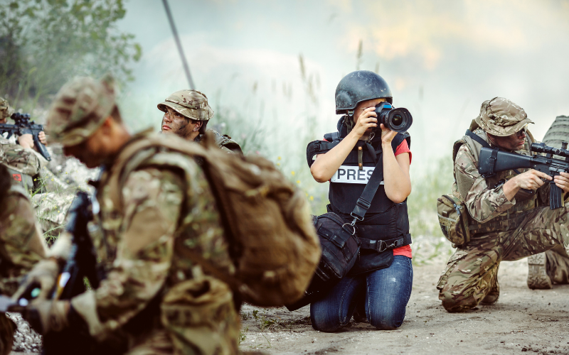 Conflict zone, reporter in a war scene